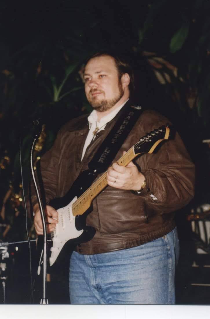 Barrett playing guitar